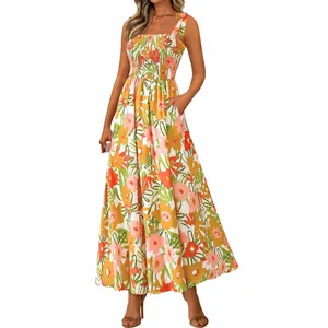 Detail of vibrant floral print maxi dress with smocked bodice and tie straps.