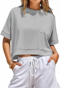 Detailed view of a casual gray oversized crop top featuring a chest pocket and raw hem