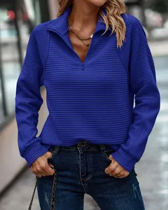 Women's royal blue quarter-zip sweatshirt with textured quilted snake pattern design