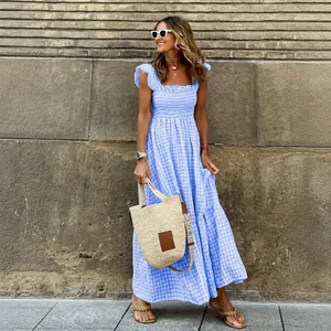 Elegant summer blue gingham maxi dress with smocked bodice and ruffle shoulder straps