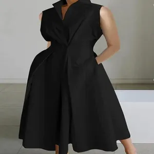 Close-up of elegant black sleeveless V-neck dress with a flared swing skirt design.