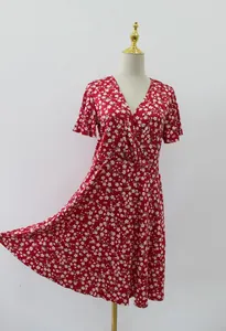 Detailed view of a red floral V-neck midi dress with short sleeves and A-line cut