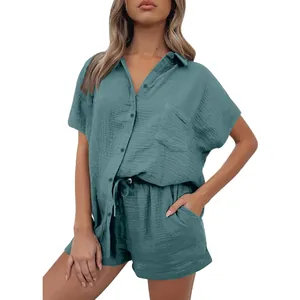 Close-up of a stylish women's casual teal cotton linen two-piece shirt and shorts set