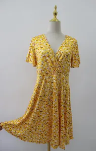 Elegant yellow floral wrap V-neck A-line Midi dress featuring short flutter sleeves