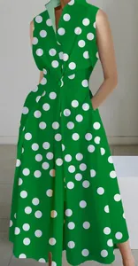 Green sleeveless dress with large white polka dots and elegant collar detail.