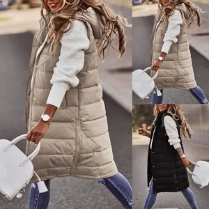 Detailed street style view of women's long hooded puffer vest in beige and black.