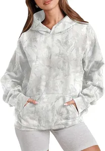 Detailed view of a trendy women's gray and white tie-dye hooded sweatshirt on model