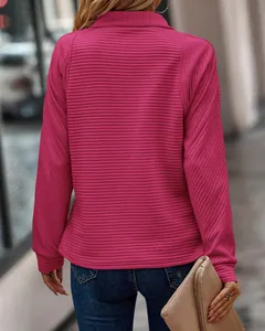Back view of magenta long sleeve sweatshirt featuring a unique ribbed snake-bone texture