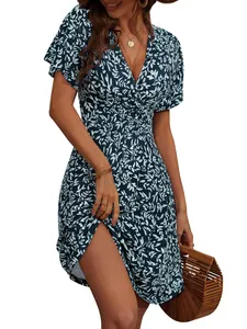 Detail shot of navy blue floral wrap midi dress with V-neckline and side split design.