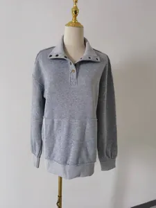 Casual grey long-sleeved sweatshirt for women featuring a button collar and front pocket