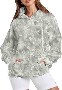 Detail view of a women's oversized hoodie with a gray camouflage pattern and pouch pocket.