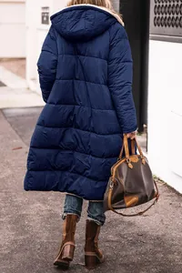 Back view of a long navy blue hooded puffer jacket featuring a warm, quilted design.
