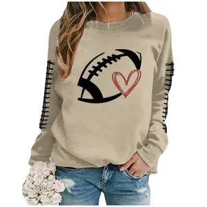 Khaki crewneck sweatshirt with rugby football and red heart graphic print detail view.