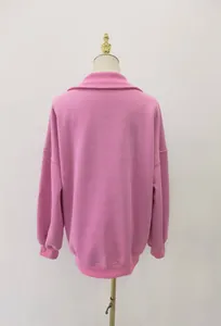 Back view of a pink oversized sweatshirt featuring a soft fleece lining and lapel collar.