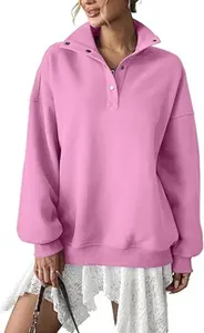 Close-up of pink oversized fleece sweatshirt showing button lapel and collar detail