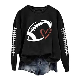Detail view of women's black sweatshirt with football heart print and sleeve stitching