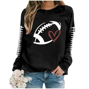 Close-up of black women's sweatshirt featuring football and heart graphic print