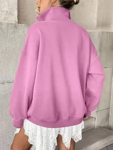Oversized pink fleece-lined sweatshirt with button Henley collar shown from the back