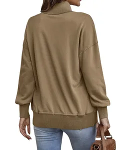 Rear view of a khaki oversized turtleneck sweatshirt featuring ribbed cuffs and hem.