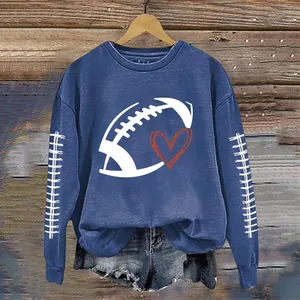 Detail view of blue crewneck sweatshirt with football heart print and sleeve stitching