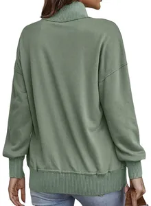 Back view of a sage green oversized turtleneck sweatshirt with ribbed cuffs and hem.