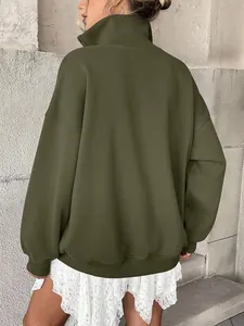 Back view of an oversized olive green fleece-lined sweatshirt with henley collar detail