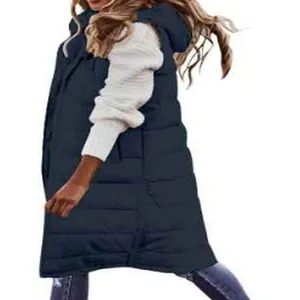 Side-back view of a long navy blue hooded puffer vest worn over a white sweater