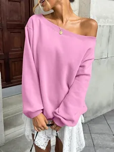 Detail shot of a pink off-the-shoulder sweatshirt for casual autumn fashion style.