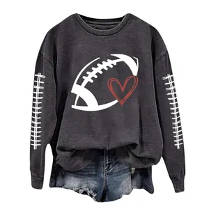 Close-up of the rugby and heart graphic print on the dark gray casual sweatshirt.