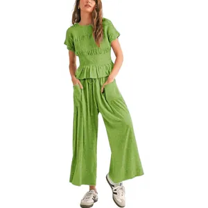 Casual women's green two-piece set with smocked top and wide-leg drawstring pants