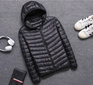 Flat lay view of a lightweight black hooded padded jacket with horizontal stitching.