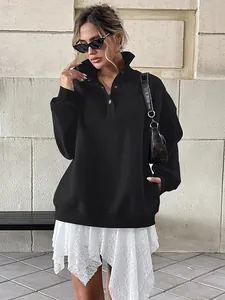 Oversized black fleece-lined Henley sweatshirt with button collar and long sleeves