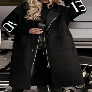 Detail of women's black hooded trench coat with sweater patchwork sleeves and number prints
