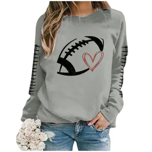 Close-up of casual gray sweatshirt with football heart graphic and sleeve details.