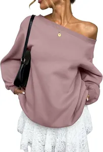 Close-up detail of a pink off-the-shoulder long sleeve sweatshirt with ribbed cuffs