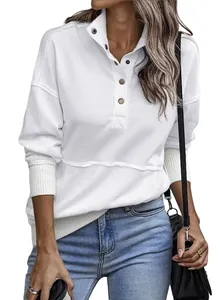 Detail of white women's sweatshirt featuring a button collar and front pocket design