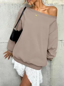 Close-up detail of oversized off-the-shoulder sweatshirt in taupe with ribbed cuffs