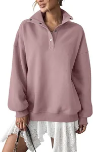 Oversized women's dusty rose sweatshirt with a buttoned henley collar and cozy fleece lining