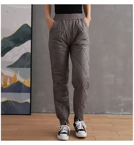 Women's gray quilted puffer pants with elastic high waist and cuffed hem detail