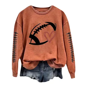 Terracotta long-sleeve sweatshirt for women featuring a football heart print detail