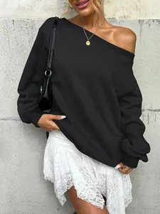 Chic black off-the-shoulder sweatshirt with long sleeves for a trendy autumn street look