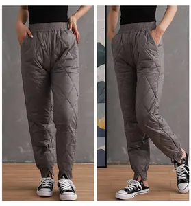 Women's warm grey quilted high-waist winter joggers with thermal padding detail