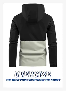 Back view detail of men's two-tone color-block hooded windbreaker jacket in black and grey