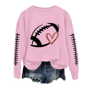 Pink women's sweatshirt with football heart print, featuring decorative sleeve stitching.