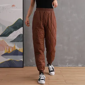 Women's minimalist brown quilted padded jogger pants for winter warmth and comfort