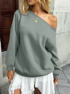 Close-up of elegant solid grey off-the-shoulder sweatshirt for casual autumn style