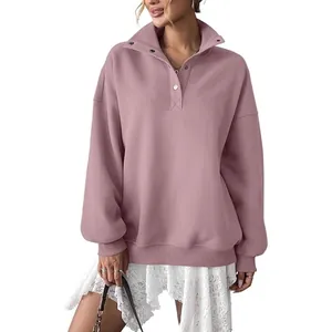 Women's oversized dusty pink Henley sweatshirt with button collar and fleece lining