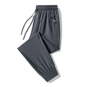 Men's grey ice silk quick-dry joggers with elastic waist, drawstring and zipper pockets