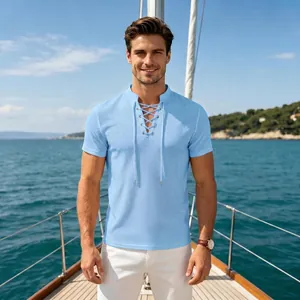 Men's casual light blue waffle knit lace-up V-neck T-shirt shown on a luxury sailboat