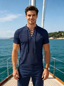 Detail view of men's navy blue lace-up polo shirt with waffle texture on a yacht.
